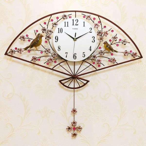 Wanduhr als Fächer mit Vogelmotiv