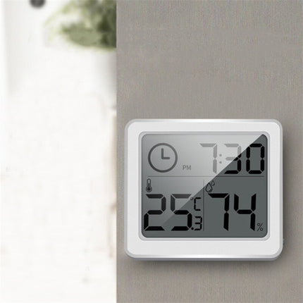 Weiße digitale Tischuhr mit Thermometer