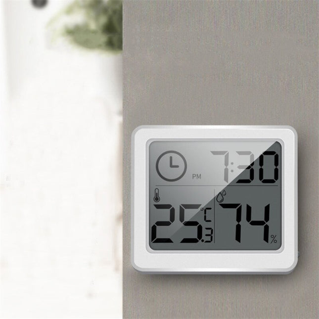 Weiße digitale Tischuhr mit Thermometer