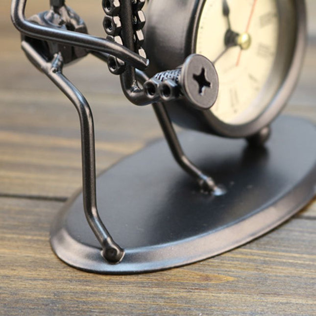 Tischuhr mit Musiker-Figur aus Eisen