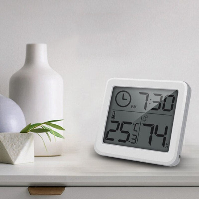 Weiße digitale Tischuhr mit Thermometer