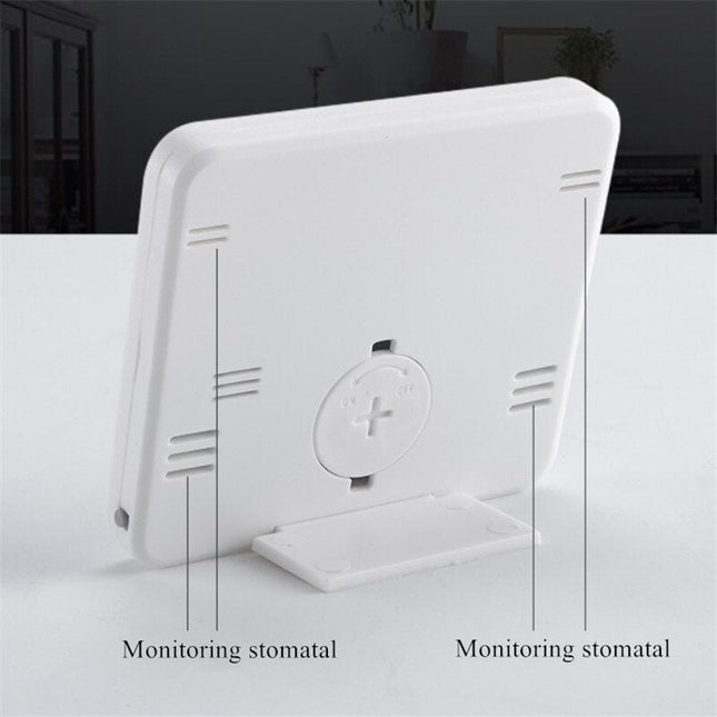 Weiße digitale Tischuhr mit Thermometer