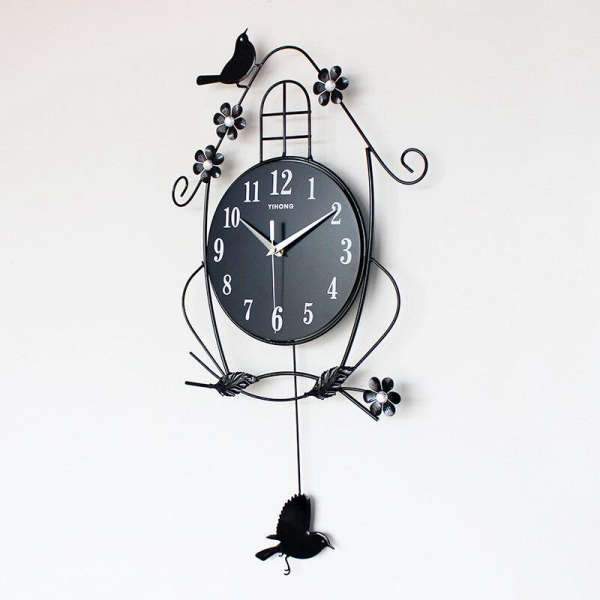 Schwarze Pendeluhr mit Vogel und Blumen