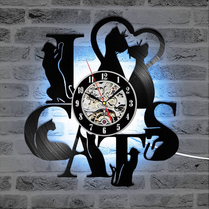 Schwarze Wanduhr aus Katzen-Silhouetten