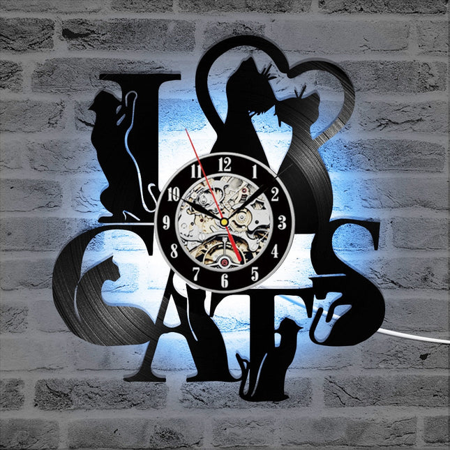 Schwarze Wanduhr aus Katzen-Silhouetten